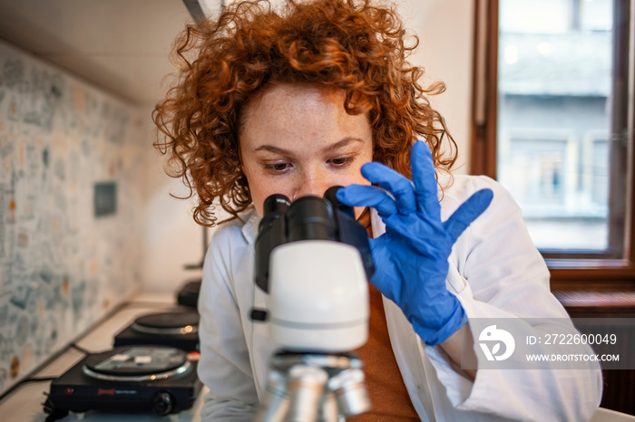 Scientist researcher using microscope in laboratory. Medical healthcare technology and pharmaceutical research and development concept. Young Scientist Working With The Microscope