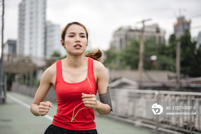 woman running in run lane in city.