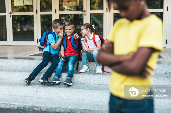 Schoolchildren isolation at primary school and bullying concept.