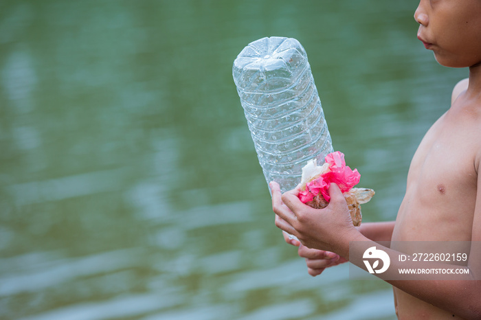 Youth collect garbage in the river, concept of National Youth Day and World Environment Day.