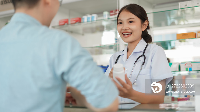 Medicine and health concept, Female pharmacist hold pill bottle and explain take medicine to client