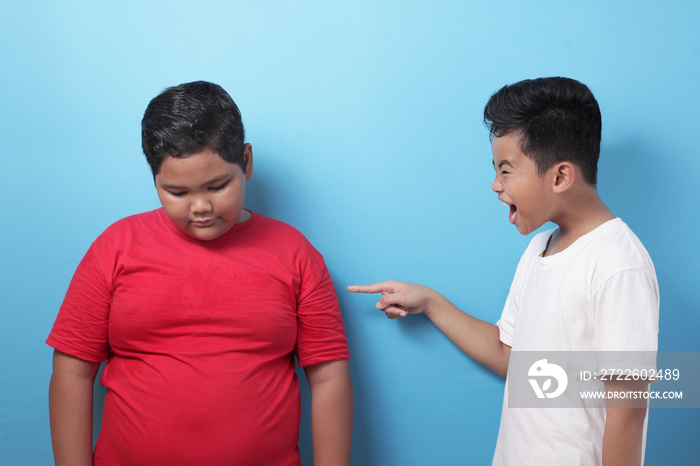 Asian boy bullying mocking other boy, fat boy get bullied at school