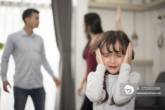 Little girl was crying because dad and mom quarrel, Sad and dramatic scene, Family issued, Children’s Rights abused in Early Childhood Education and Social and parrents care problem concept