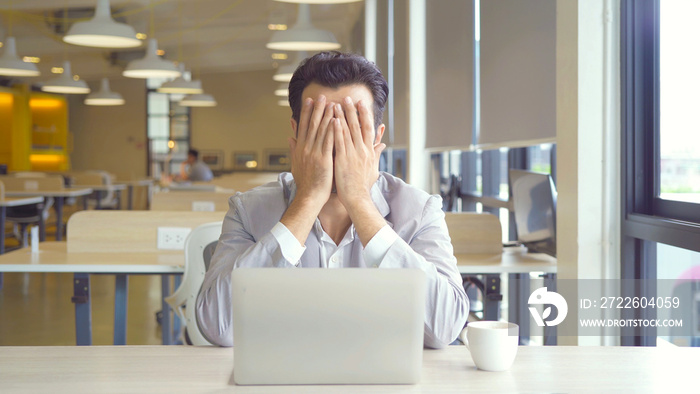 Portrait of sad depress business middle east man, person thinking about problem, working online, using a computer laptop notebook, technology device. People lifestyle.