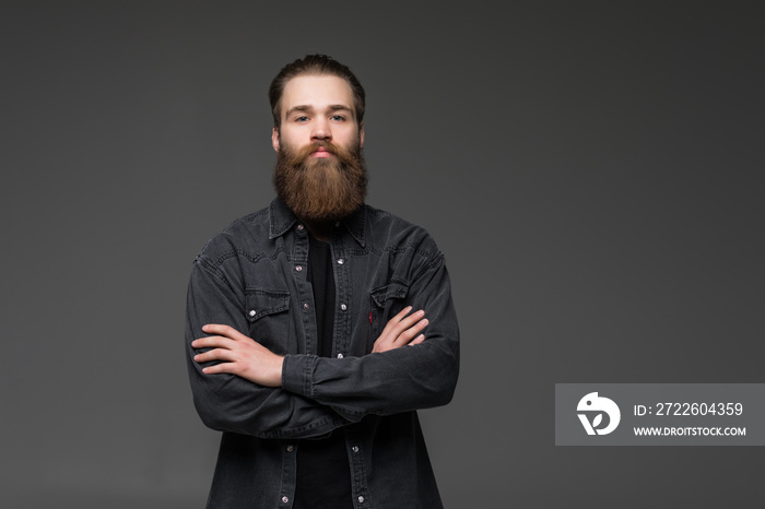 Attractive long beard man hands crossed isolated grey background