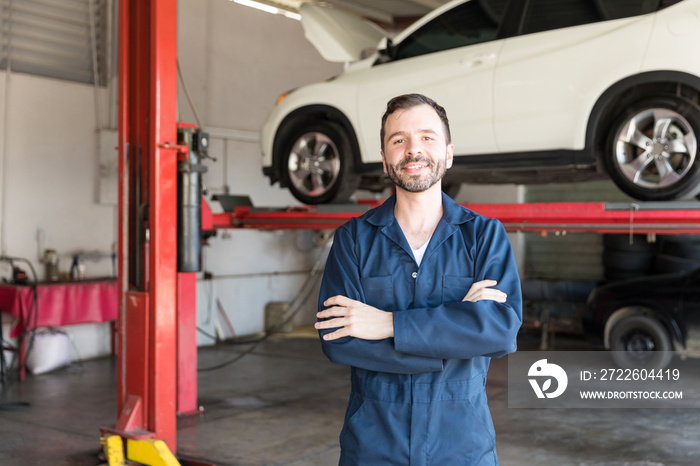 Smiling Repairman Representing Job Satisfaction In Garage