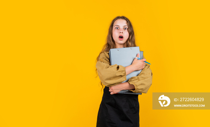 follow your own style. too much paperwork. kid with long hair hold folder with papers.