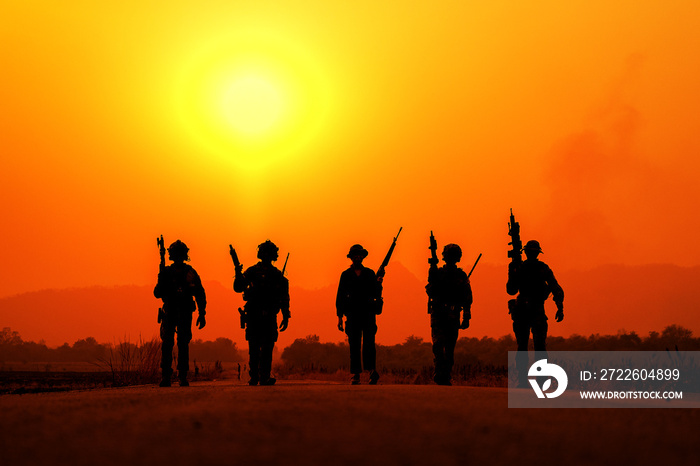 The silhouette of a military soldier with the sun as a Marine Corps for military operations