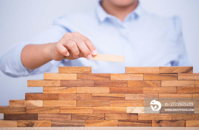 Woman build a tower puzzle