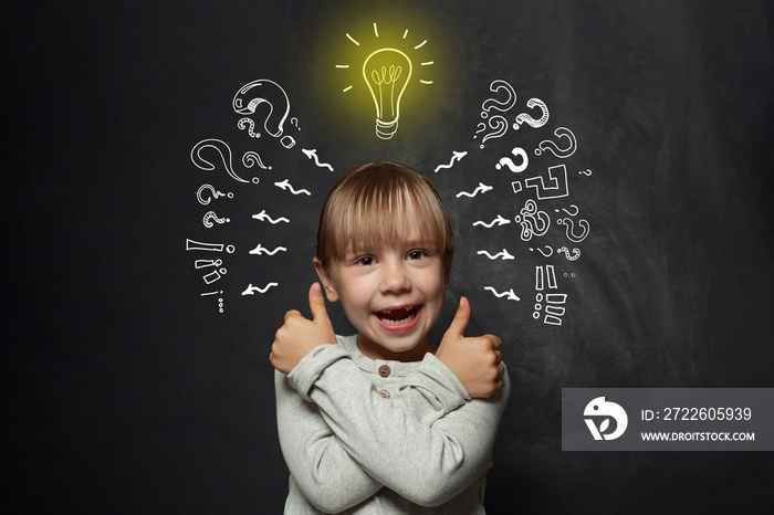 Cute child with light bulb. Idea concept