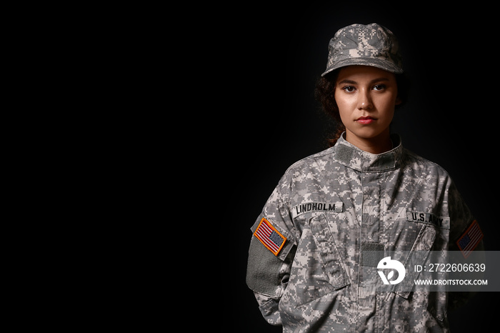 African-American female soldier on dark background