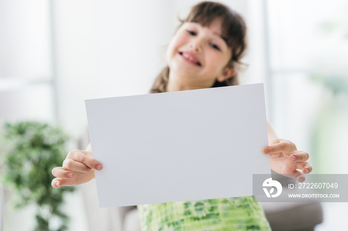 Cheerful girl holding a sign