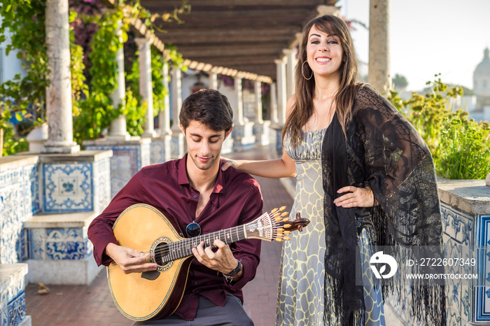 Band performing traditional music fado under pergola with azulejos in Lisbon, Portugal