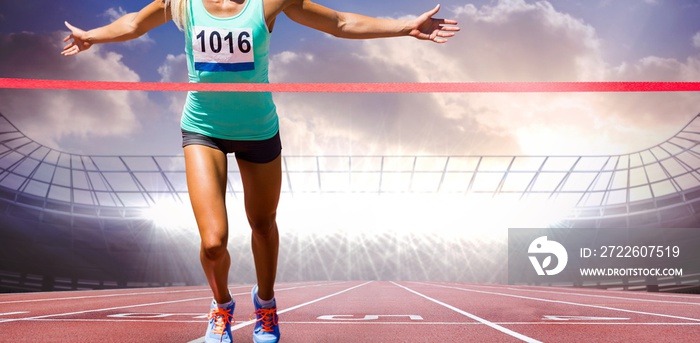 Composite image of sportswoman finishing her run