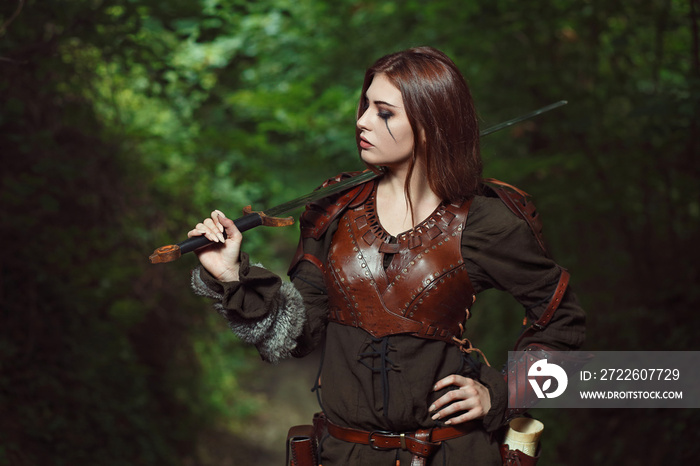 Female warrior posing with sword