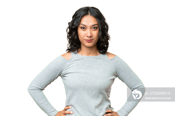 Young Argentinian woman over isolated background angry