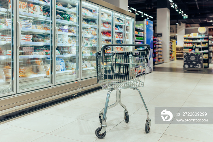 Shopping cart in supermarket. No people