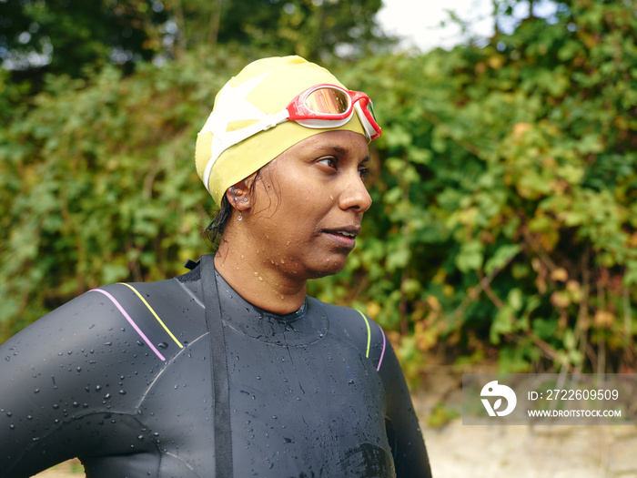 Woman in swimming cap and goggles