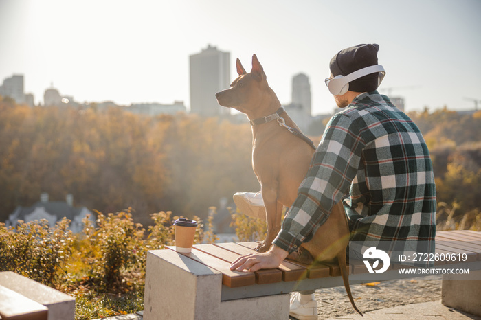 Peaceful photo of man and his dog stock photo