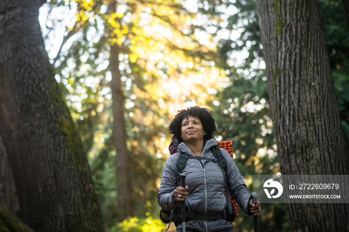 U.S. Army female soldier putting in the miles with an early morning hike in the NorthWest.