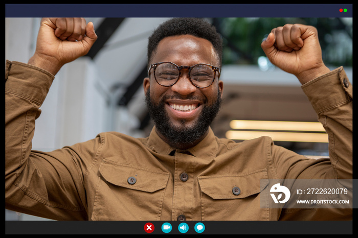 Smiling man celebrating in video call