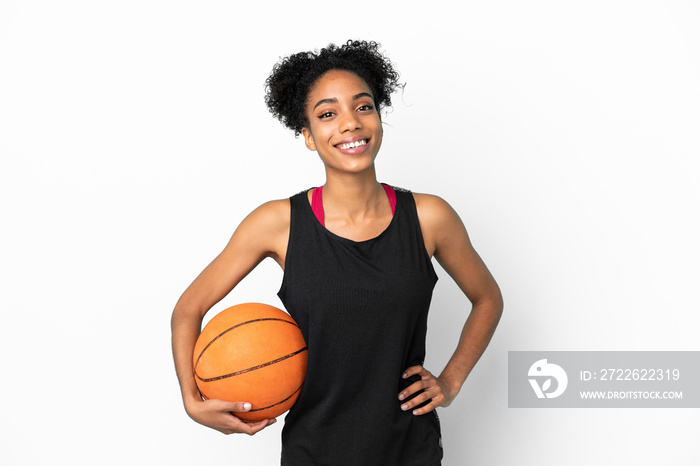 Young basketball player latin woman isolated on white background posing with arms at hip and smiling