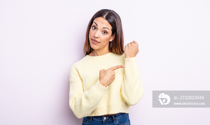 pretty hispanic woman looking impatient and angry, pointing at watch, asking for punctuality, wants to be on time