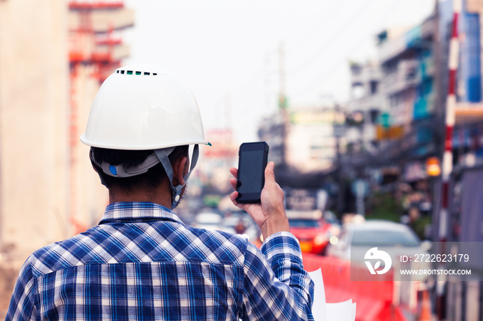 Foreman for construction control, use phone to communicate with staff