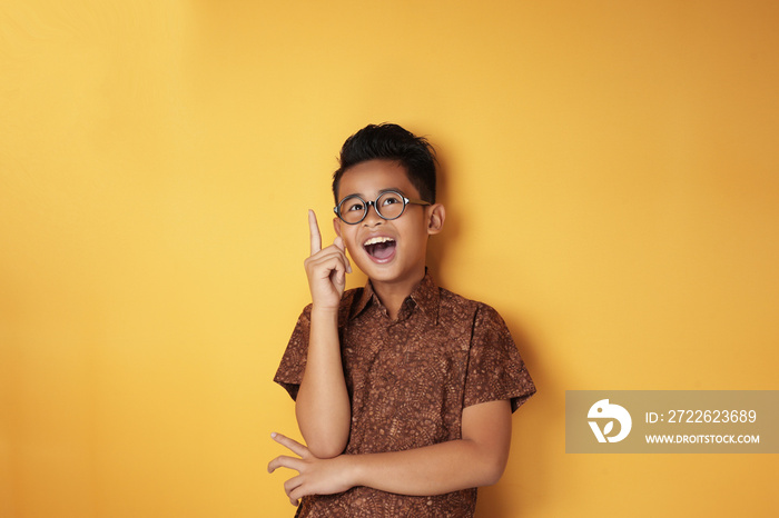 Smart Asian Boy Looking and Pointing Up Having Good Idea Gesture