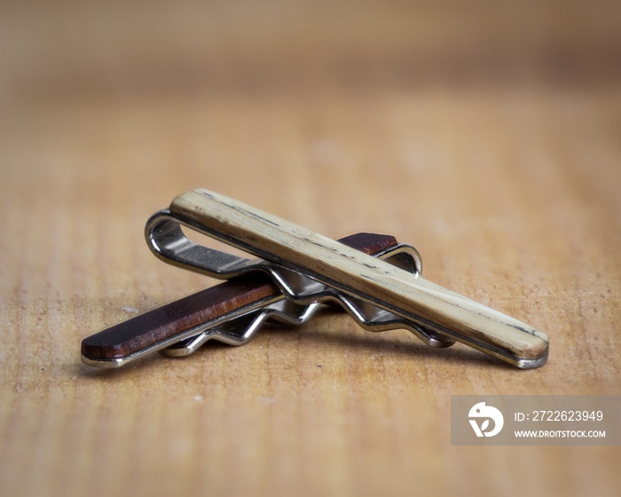 A set of wooden tie clips