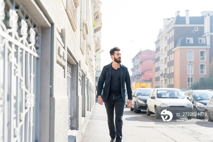 young man bearded outdoor walking