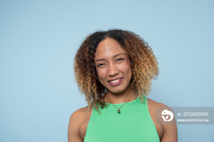 Portrait of smiling woman with curly hair