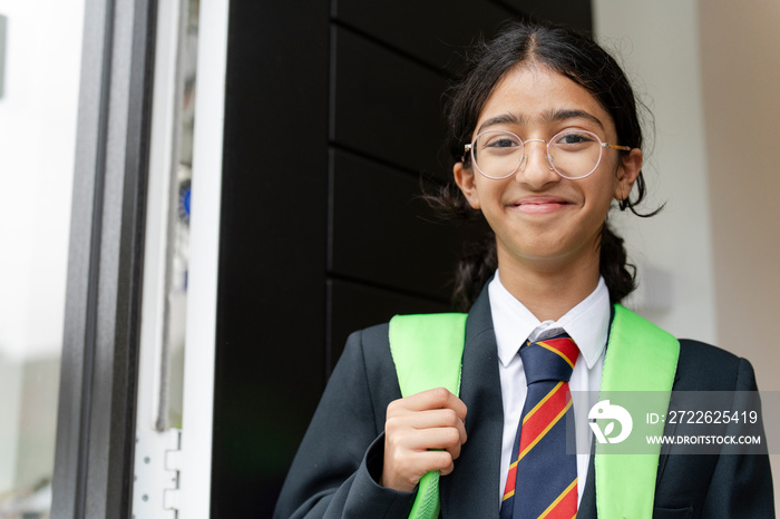 Schoolgirl leaving home for school