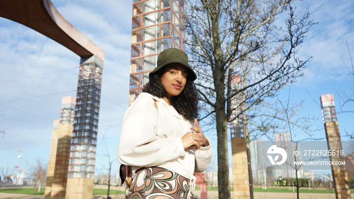 Portrait of woman in hat outdoors