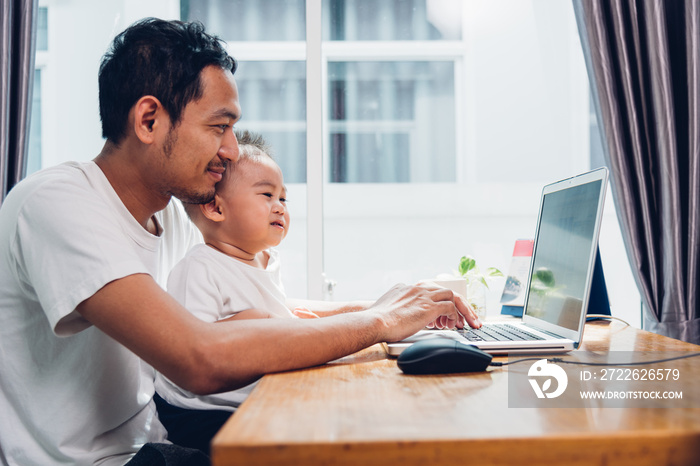 Man father using working on laptop computer