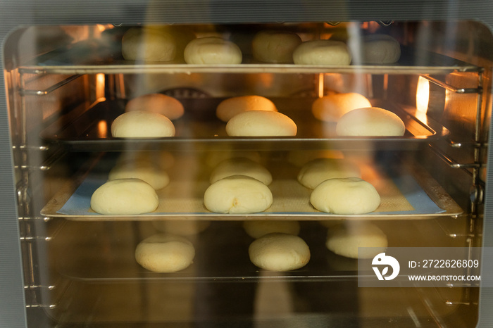 Raw dough in oven