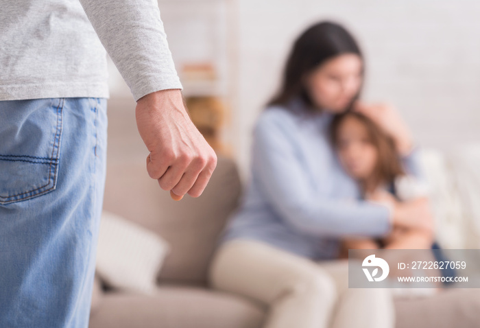 Domestic abuse. Scared woman and little girl suffering from father’s violence