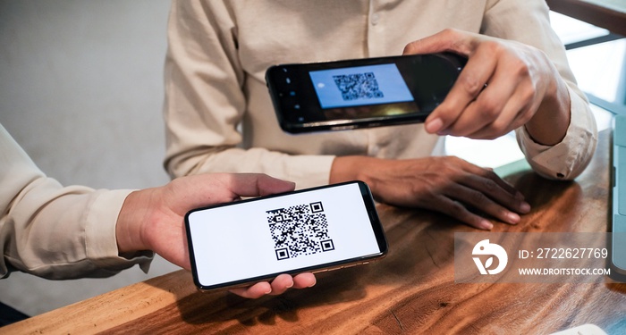 Qr code payment. Woman scanning QR code online shopping cashless technology concept.