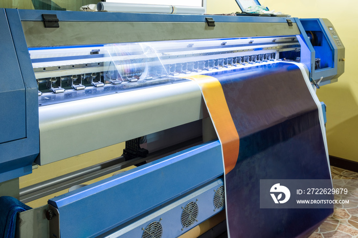 Large inkjet printer head working on blue vinyl