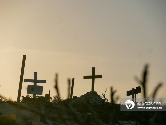 cross on the hill at sunset in aruba at pet cemetery