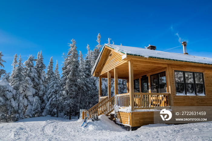 Wooden cabin at the edge, perfect winter day for a hike, Megantic national park, Quebec, Canada