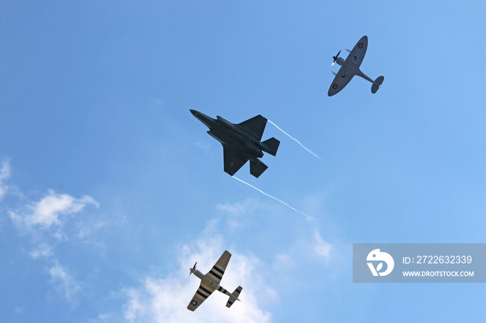 Spitfire, F-35 Lightning and  P-51 Mustang airplanes from below