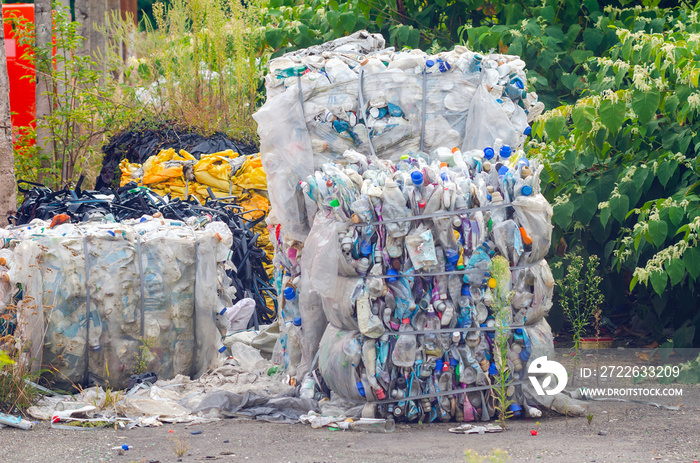 Plastic bottles pressed into bales, preparation for processing