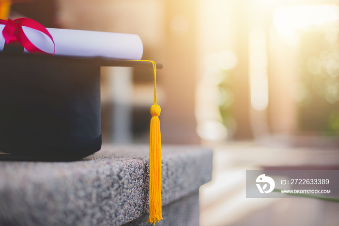 Close-up focus of university graduates placing a bachelor’s certificate and a commemorative cap at the graduation ceremony. Success, celebration