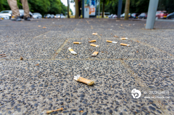 cigarette butts on the street smoking is bad for your health