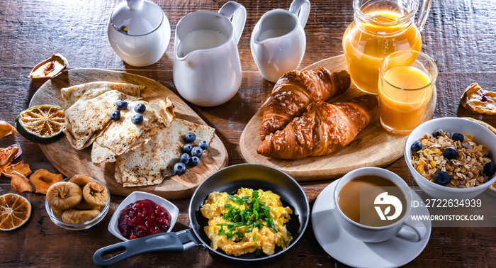 Breakfast served with coffee, eggs, cereals nd croissants