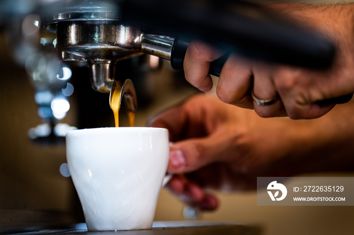 Hot steaming almond milk coffee being make in Australia.