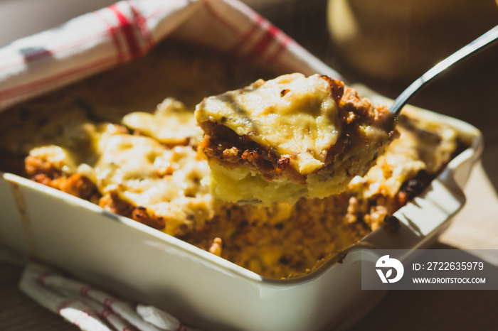 Shepherd’s pie in white baking dish on the table