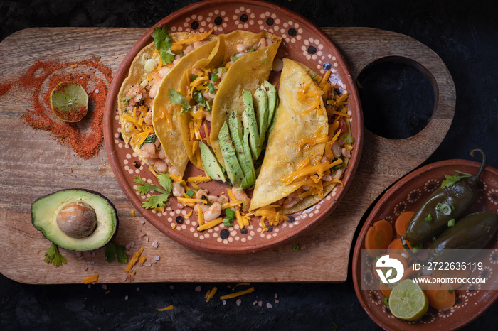 Vegetarian soft tacos served on a traditional Mexican clay  plate