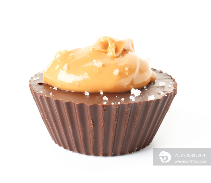 Tasty chocolate peanut butter cup on white background